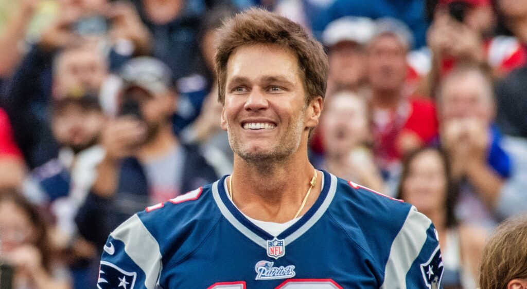 Tom Brady smiling during halftime of ceremony.