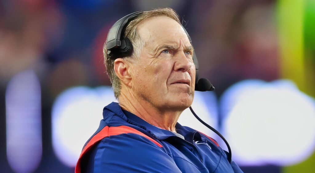 Bill Belichick of New England Patriots looking on.