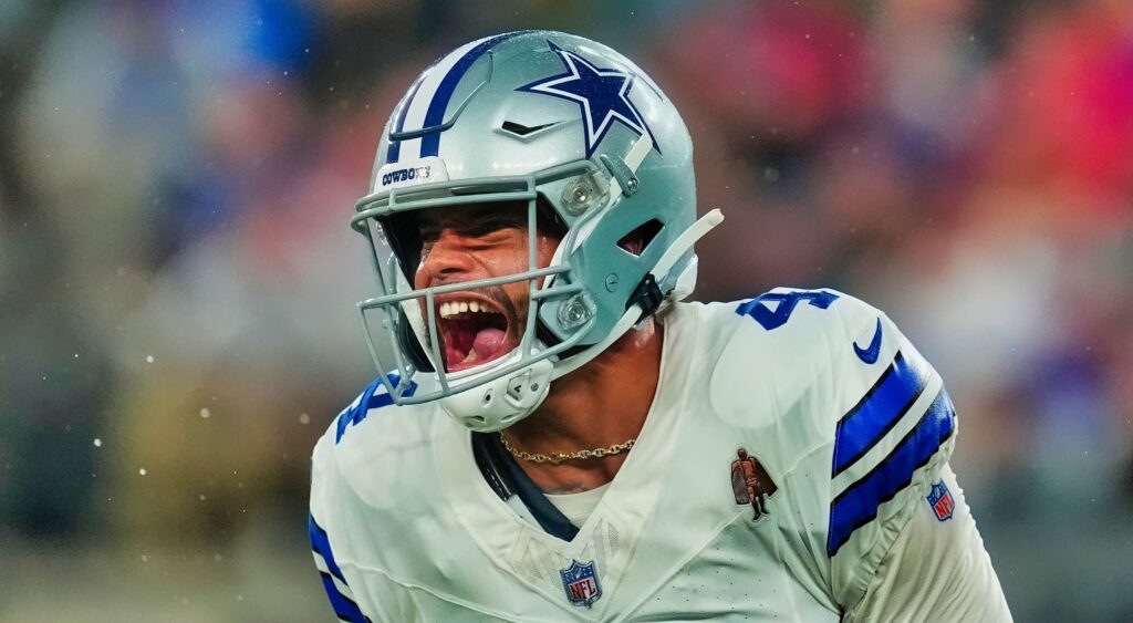 Dallas Cowboys' quarterback Dak Prescott celebrating after touchdown.