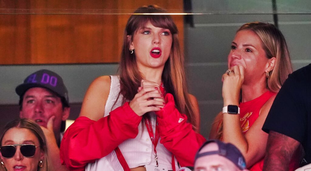 Taylor Swift looks on while watching a Chiefs game from the suite.