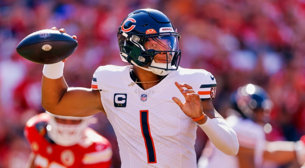 Justin Fields of Chicago Bears holding football.