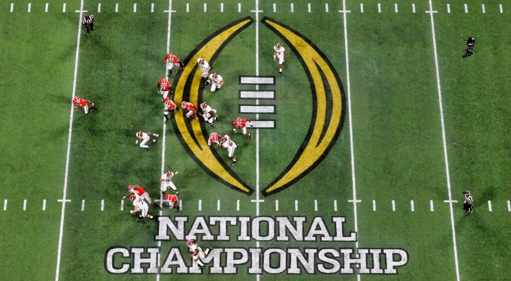 College Football Playoff logo on the field.
