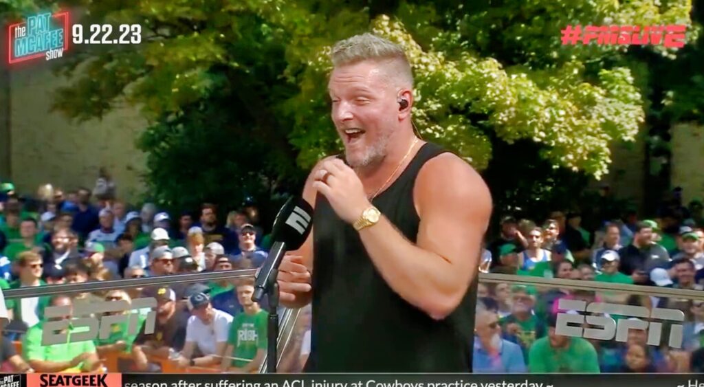 Pat McAfee laughs during his show.