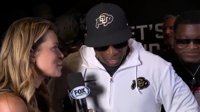 Deion Sanders being interviewed after Colorado Buffaloes' win.