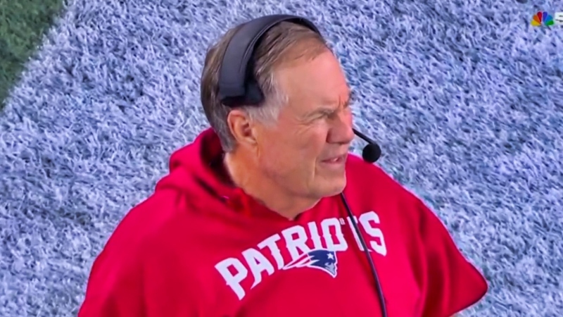 Bill Belichick looking on during game.