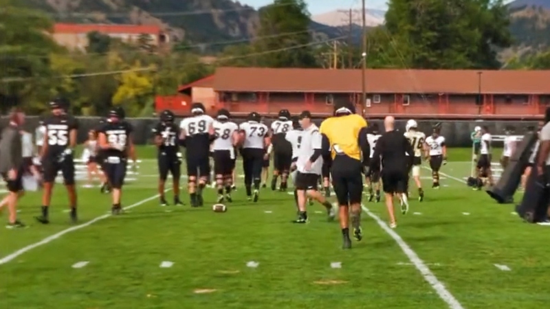 Colorado Buffaloes football players practicing.