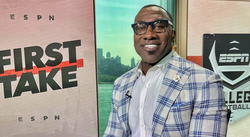Shannon Sharpe smiling while on set of First Take