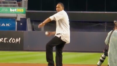Stephen A. Smith in Yankees jersey throwing baseball