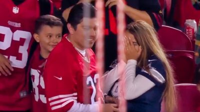 49ers and cowboys fan in stands