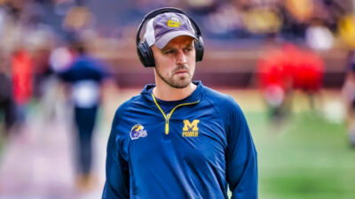 Photo of Connor Stalions in Michigan gear and headset