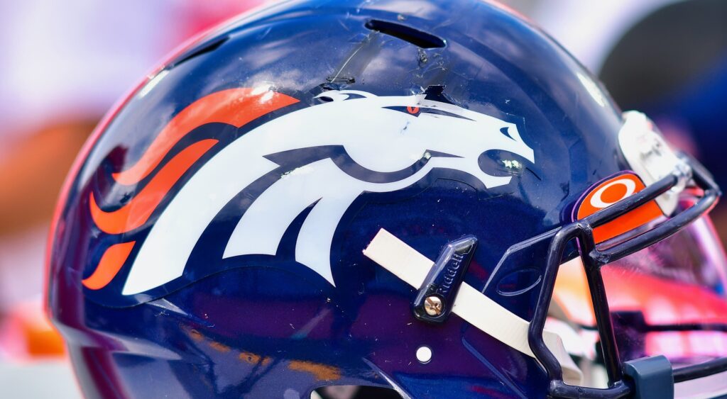 Denver Broncos helmet on the bench.