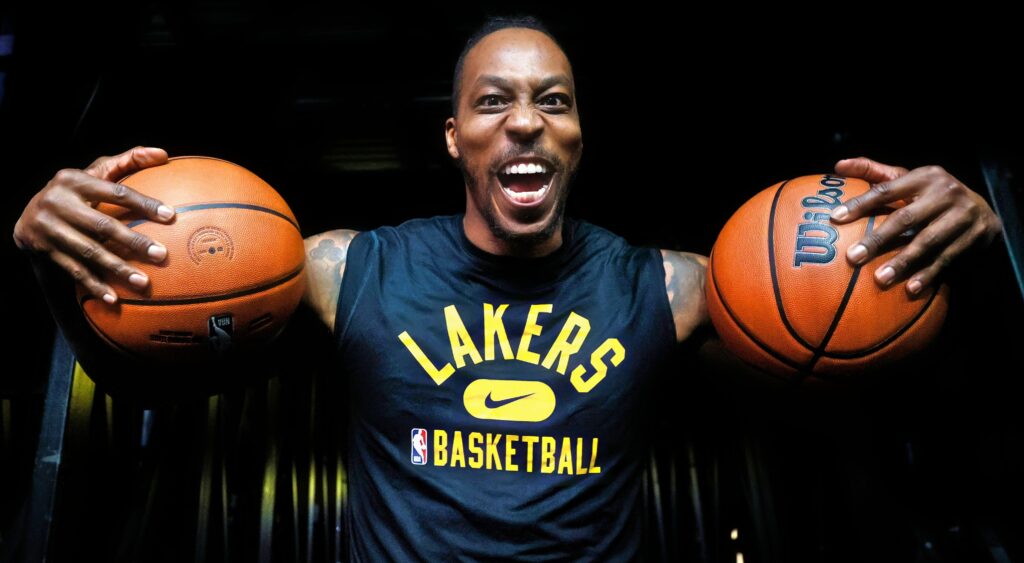 Dwight Howard holding two balls