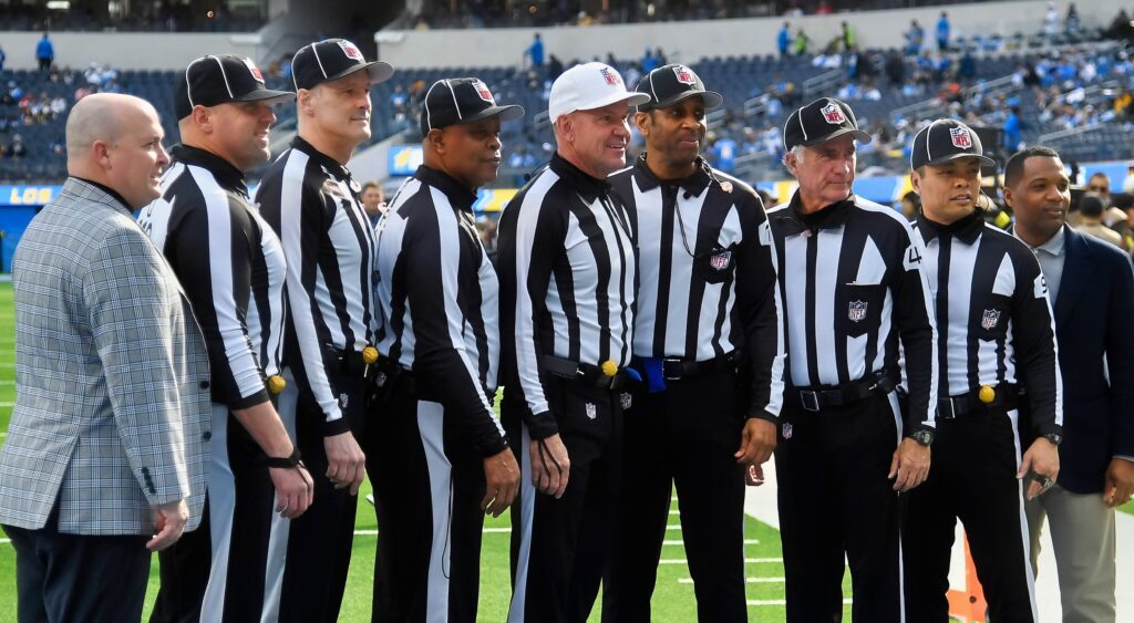 NFL referees pose for photo.