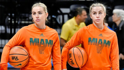 THe Cavinder Twins in in Miami Hurricanes sweaters