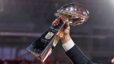 Photo of Lombardi Trophy being held in the air