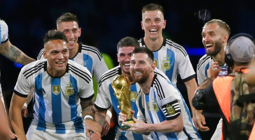 Lionel Messi holding World Cup trophy