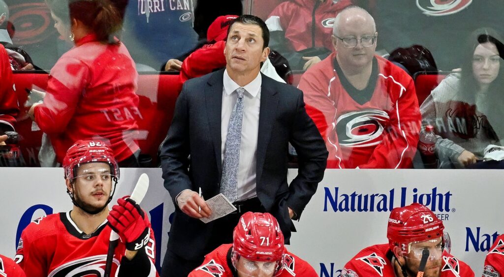 Rod Brind'Amour looking on from bench.
