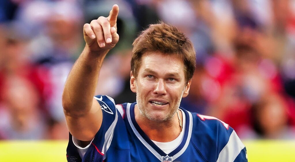 Tom Brady pointing at ceremony at Gillette Stadium.