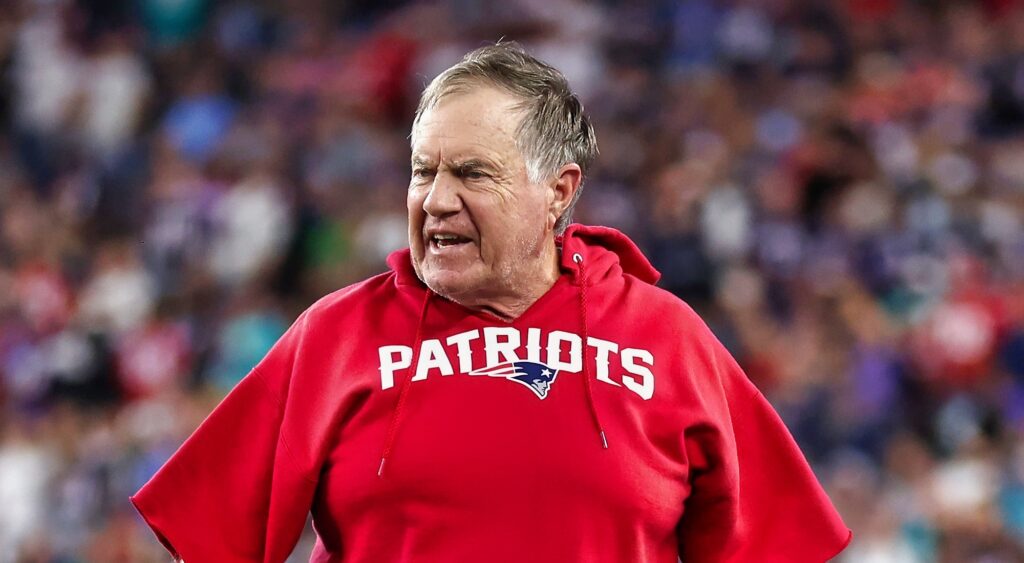 New England Patriots' head coach Bill Belichick looking on.