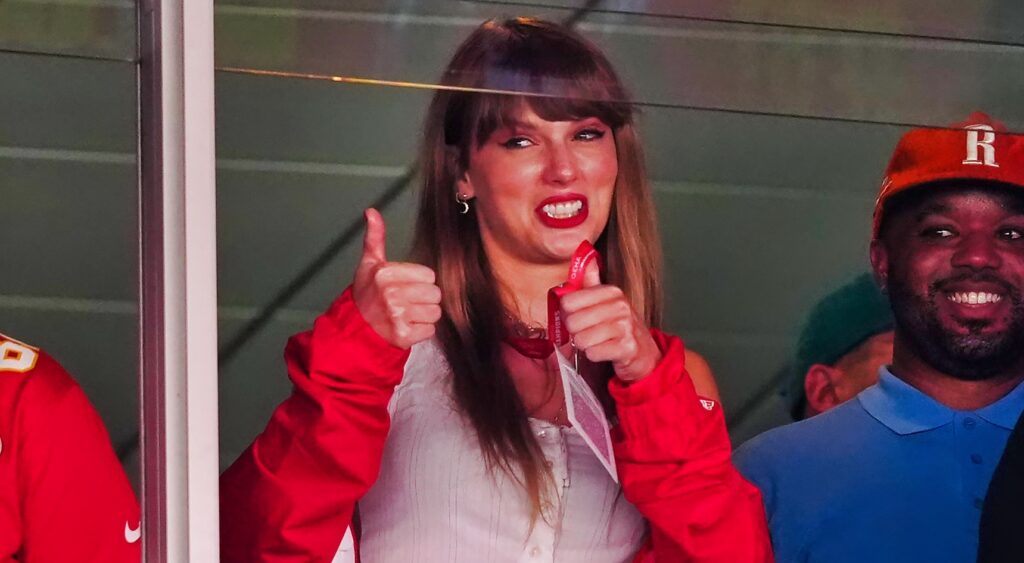 Taylor Swift gives thumbs up while watching a Chiefs game.