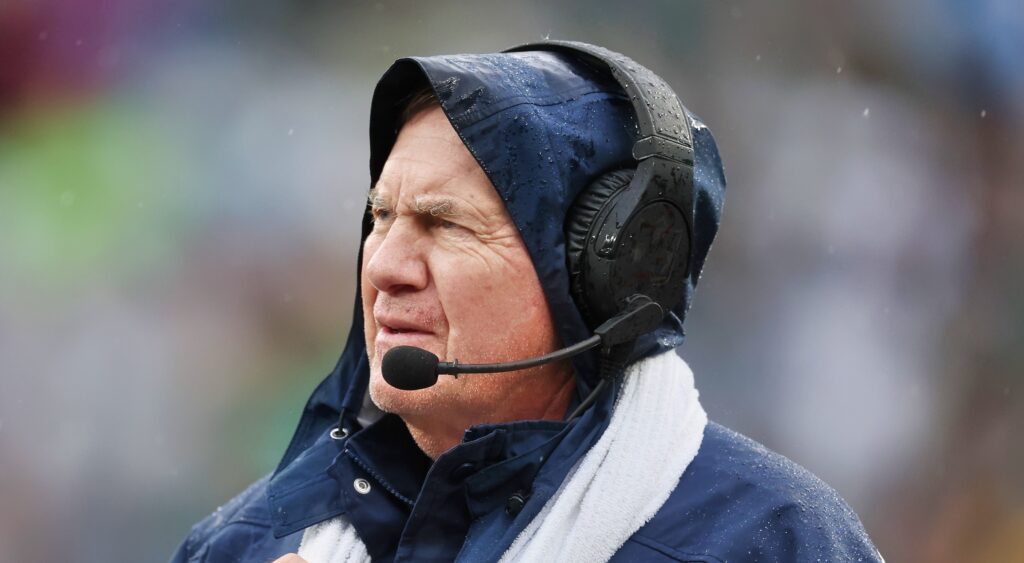 New England Patriots' head coach Bill Belichick looks on.