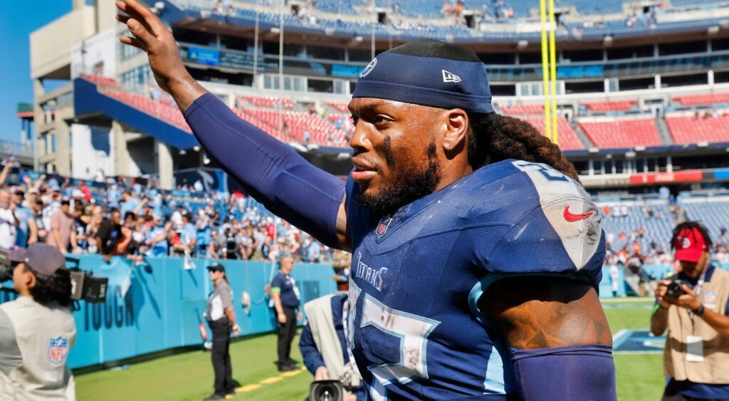 Derrick Henry waves to fans after a game.