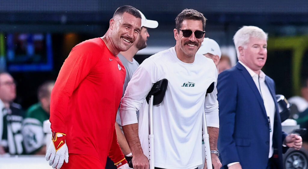 Travis Kelce and Aaron Rodgers smiling