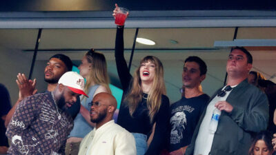 Taylor Swift Holding a drink up