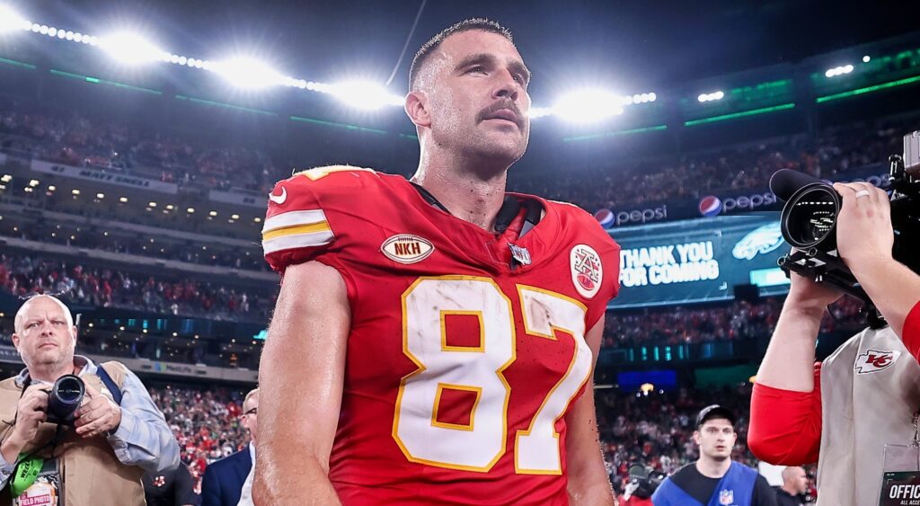 Travis Kelce walks off the field after a game.