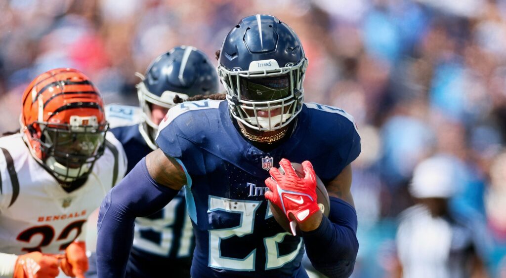 Derrick Henry of Tennessee Titans running with football.