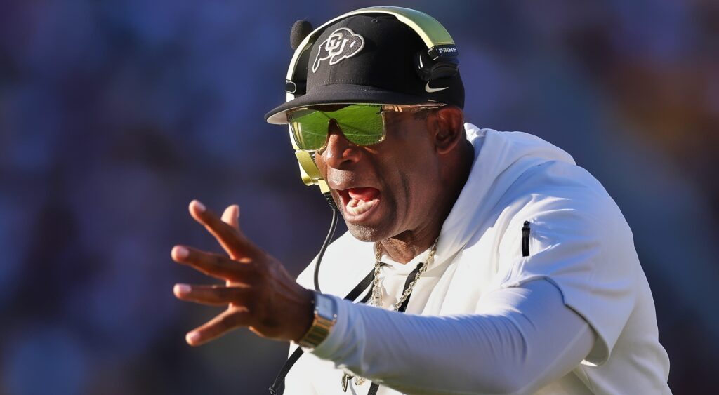 Deion Sanders of Colorado Buffaloes reacting with arm out.
