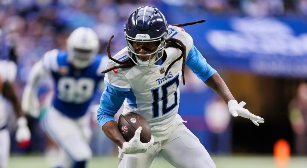 Tennessee Titans wide receiver DeAndre Hopkins running with football.