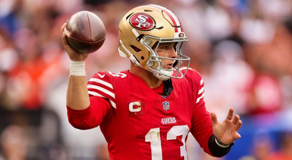 San Francisco 49ers' quarterback Brock Purdy throwing football.