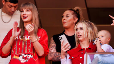 Taylor Swift standing next to Brittany Mahomes
