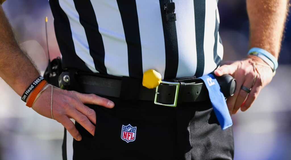 NFL referee with his hands on his waist.