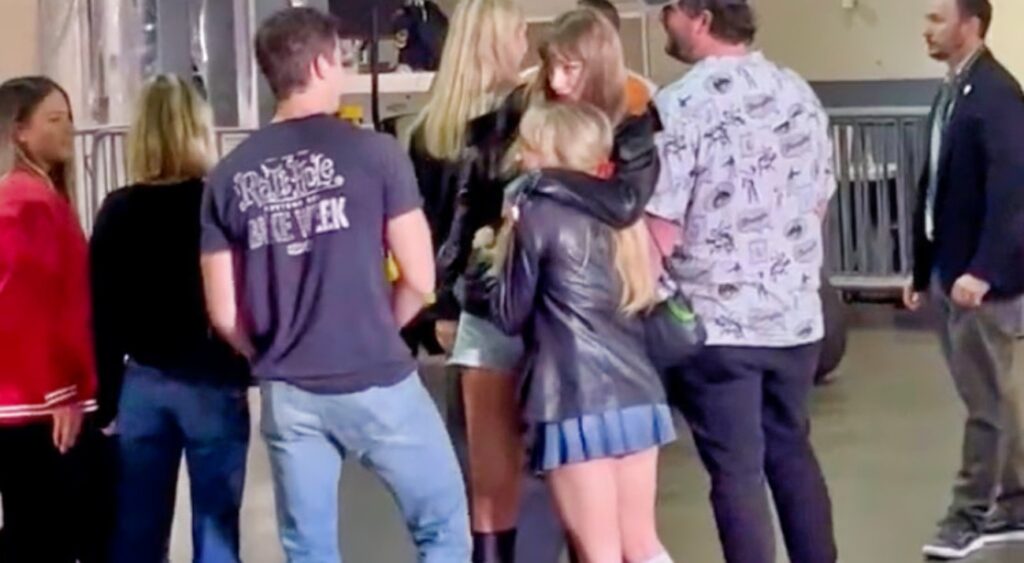 Taylor Swift hugs Sabrina Carpenter at MetLife Stadium.