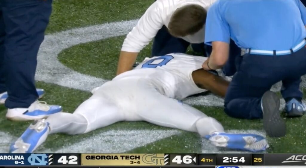 Tez Walker down after hit being attended to.