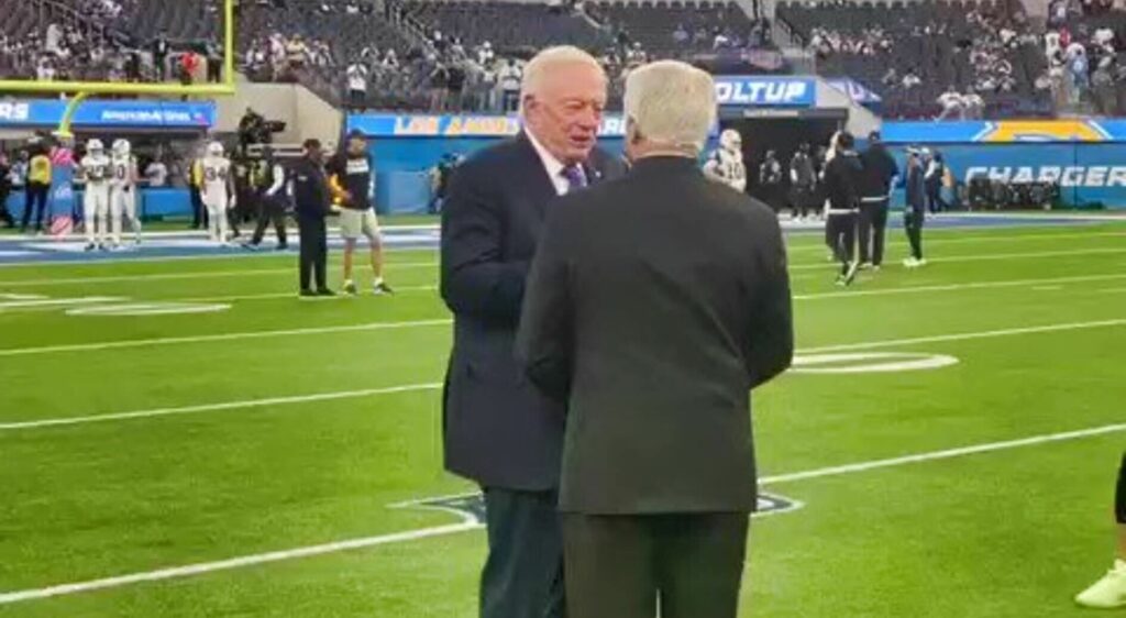 Dallas Cowboys' owner Jerry Jones talking to Jimmy Johnson.