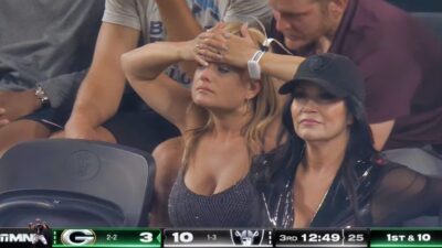 Female Raiders fan in stands