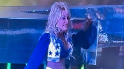 Dolly Parton performing during halftime at Cowboys game