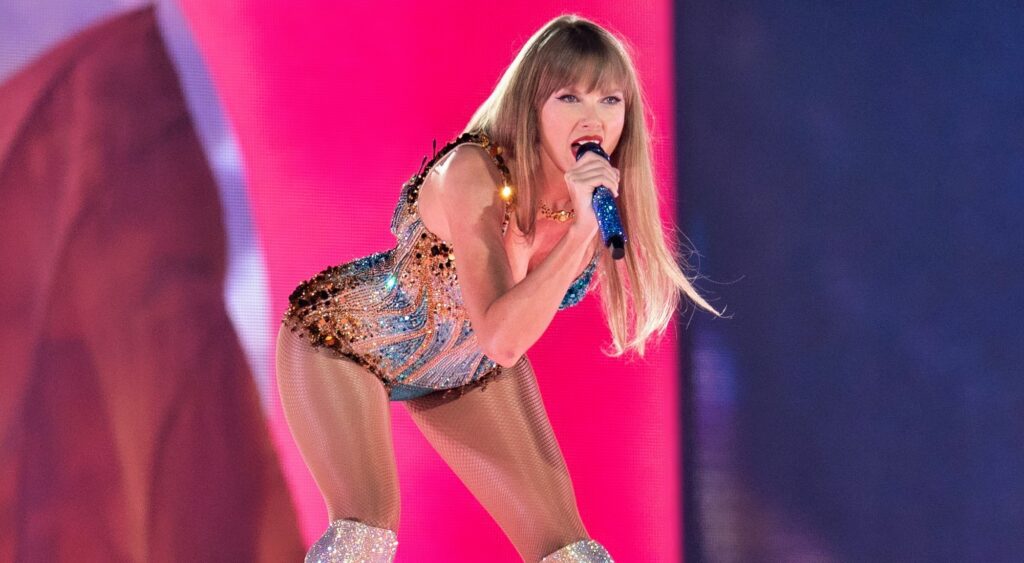 Taylor Swift performs at a concert.