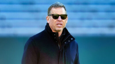 Troy Aikman in sunglasses and coat