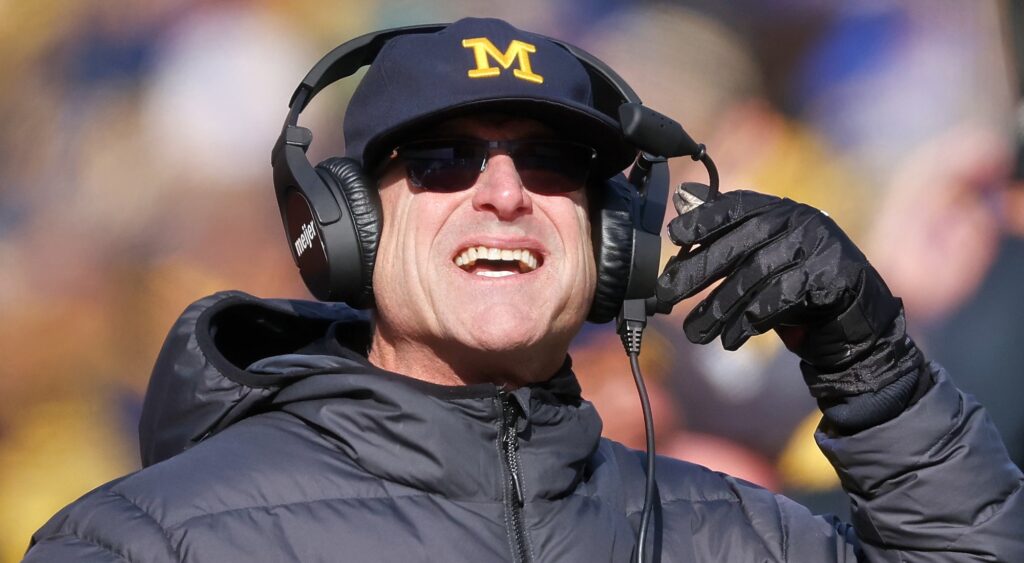 Michigan head coach Jim Harbaugh looking on during game.