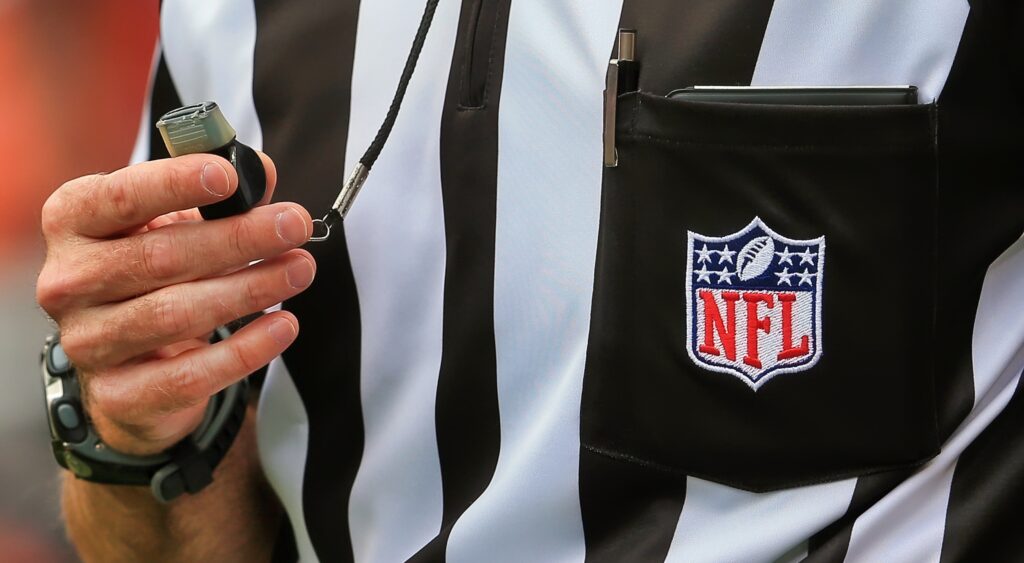 Referee's uniform and whistle.