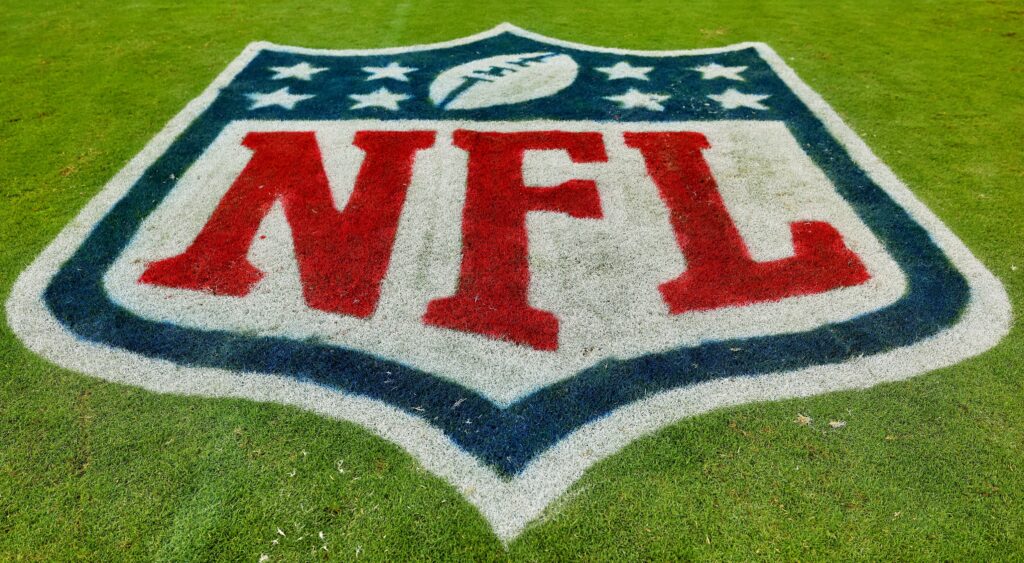 NFL logo on the field.