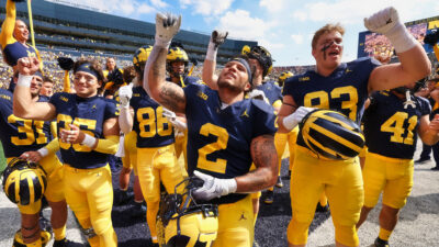 Michigan Wolverines players celebrating after win