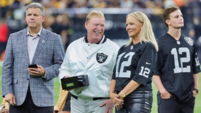 Mark Davis smiling with other Raiders brass