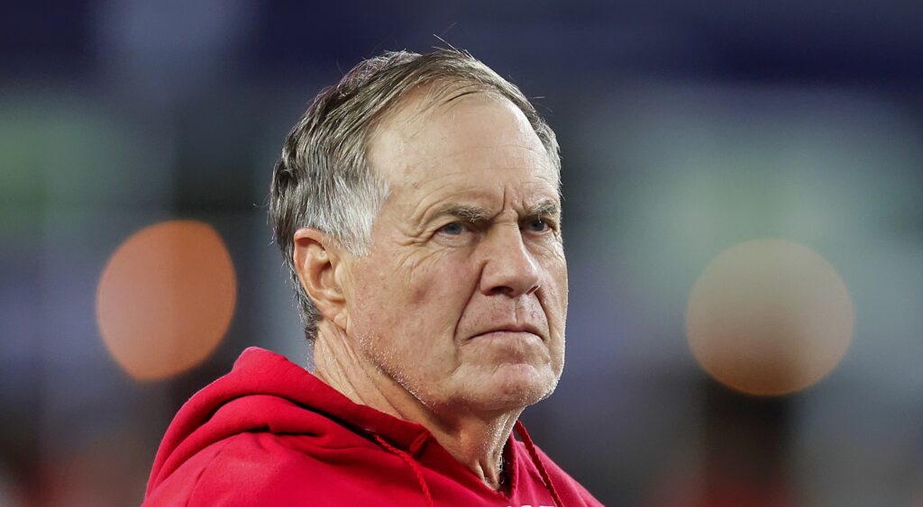 New England Patriots head coach Bill Belichick looking on during game.