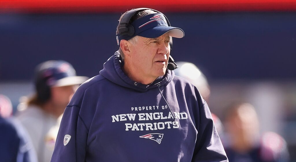 New England Patriots head coach Bill Belichick looking on.