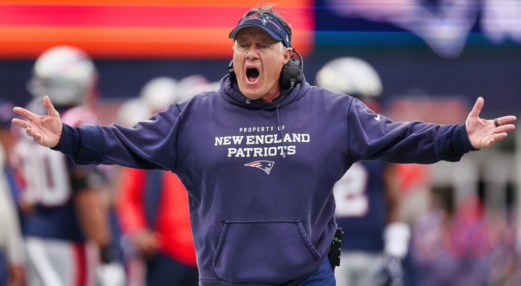 Bill Belichick with his arms stretched out and him yelling